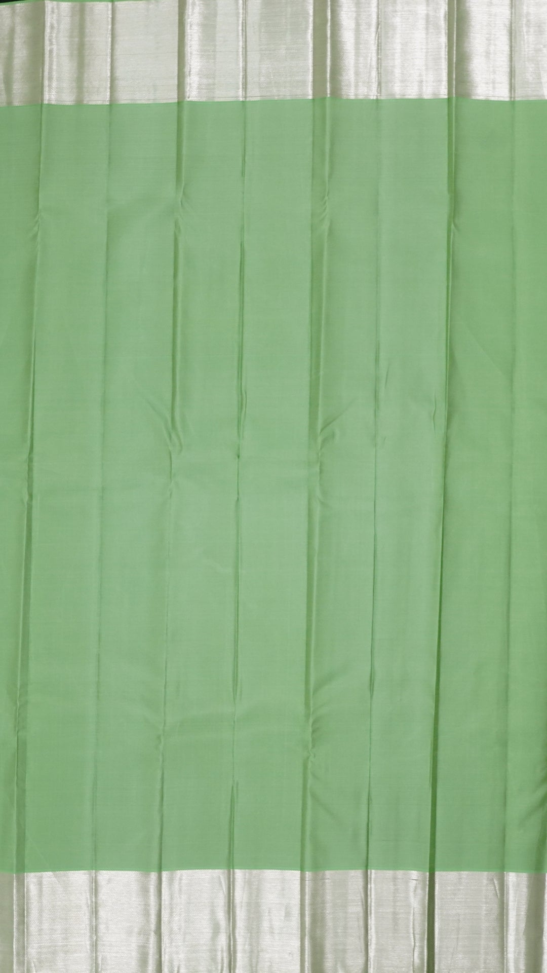 Sea Green Kanchi Pattu Saree with Silver Butta Detailing