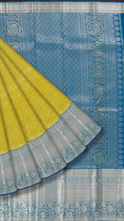 Yellowish Green Kanchipuram Saree with Silver Zari and Blue Contrast Border