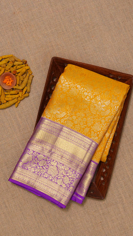 Yellow Kanchi Pattu Saree with Purple Zari Border