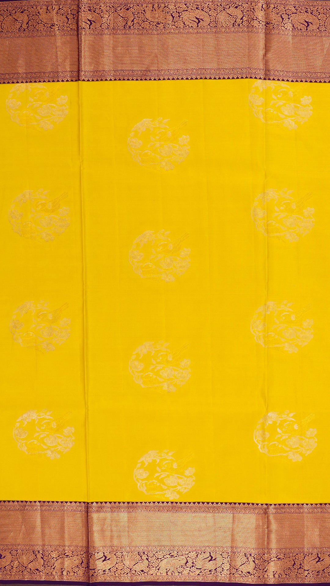 Bright Yellow Kanchipuram Saree with Dark Purple Pallu