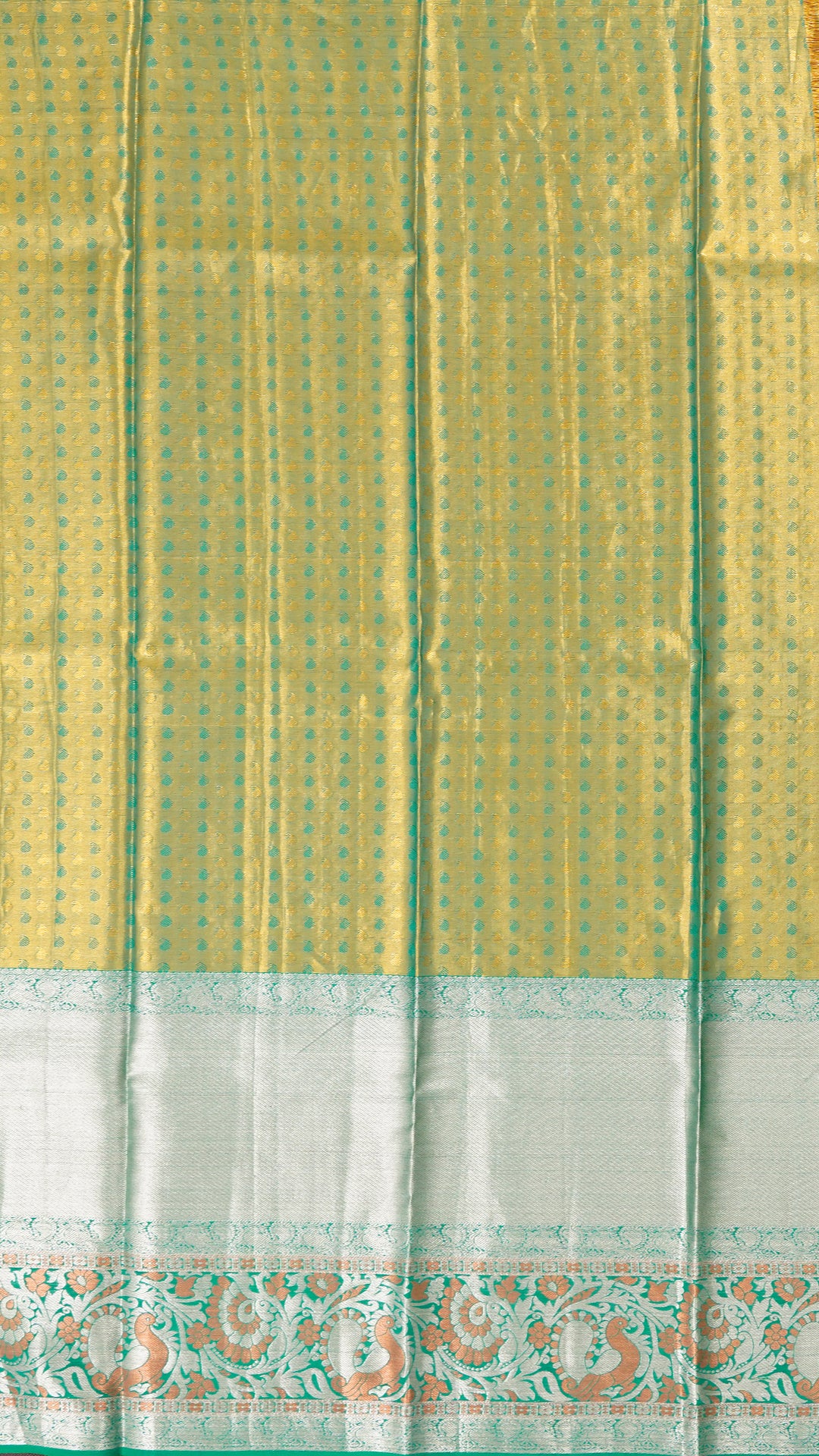 Golden Pattu Pavada with Silver Zari Butta and Green Border