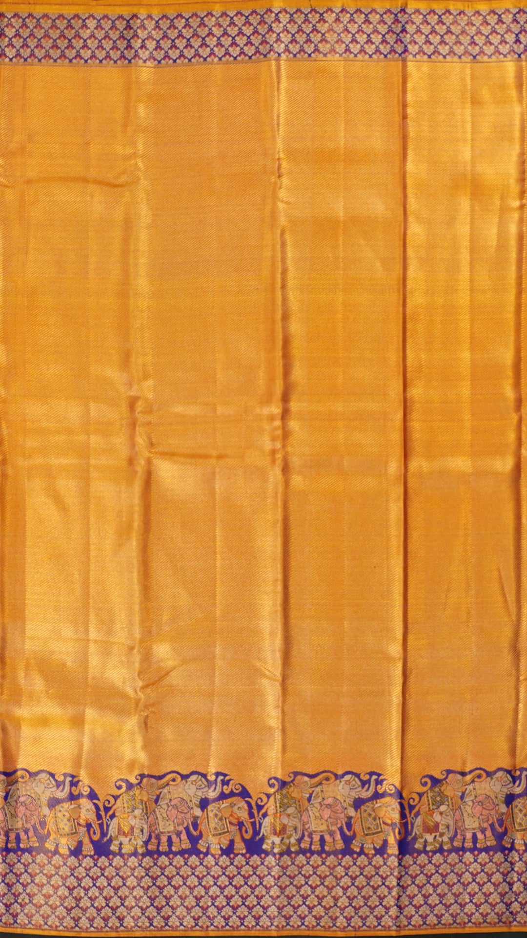 Golden Saree with Ink Blue Border and Elephant Design.