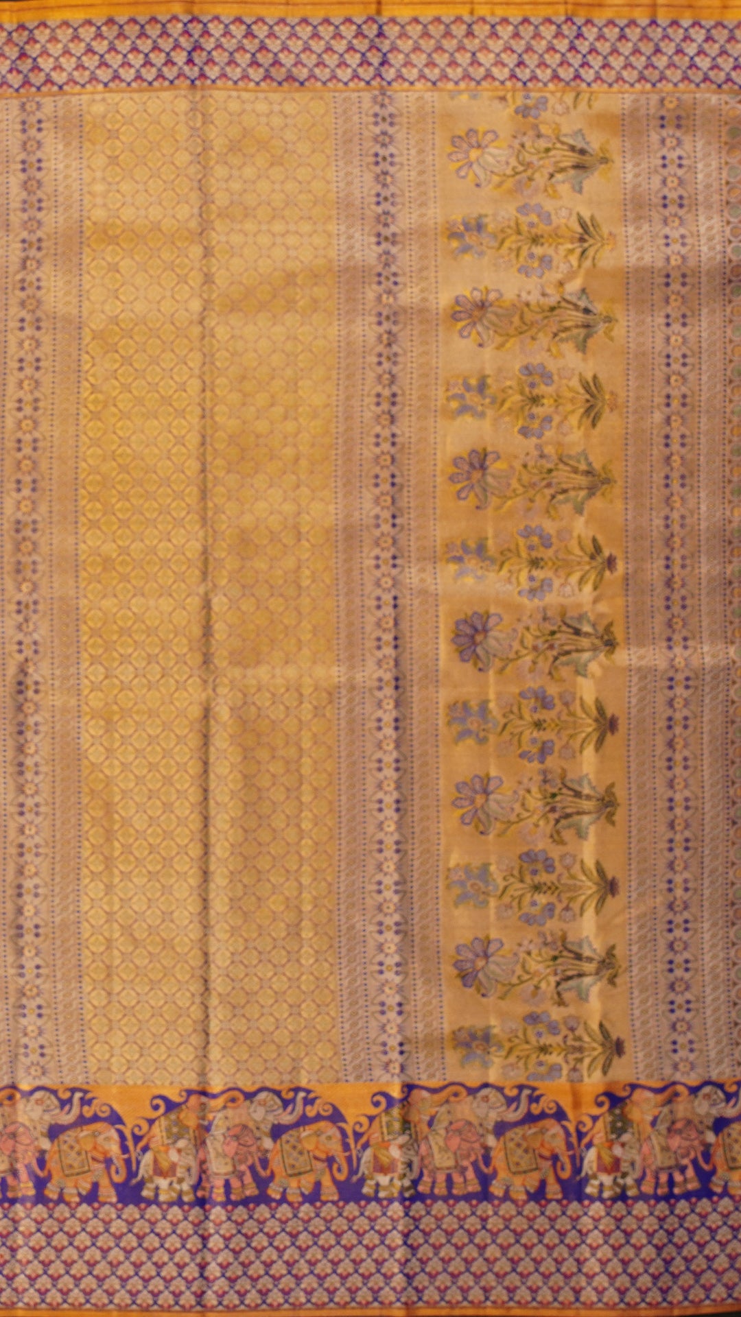 Golden Saree with Ink Blue Border and Elephant Design.