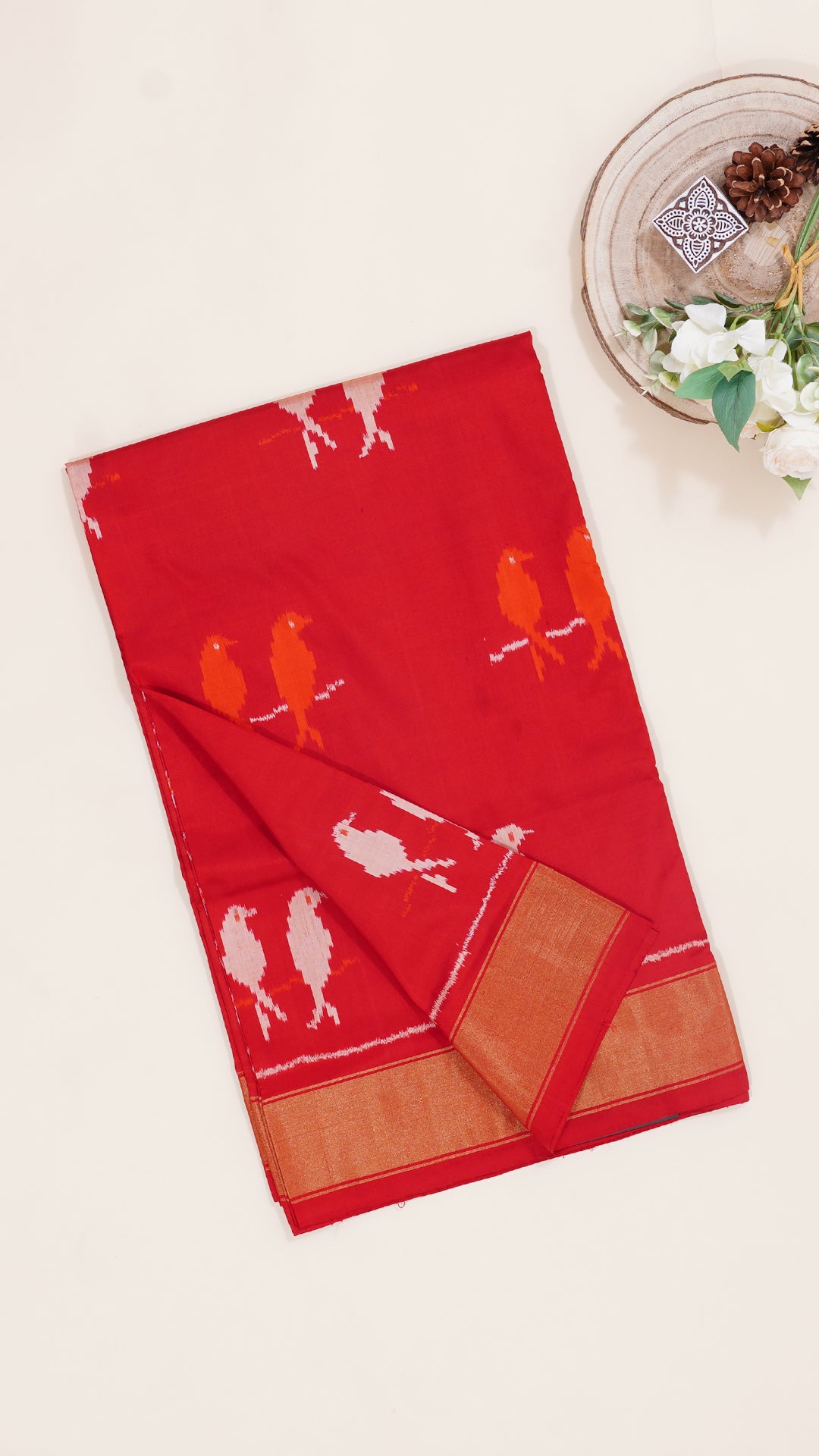 Bright Red Ikkat Silk Saree with Bold Buttas